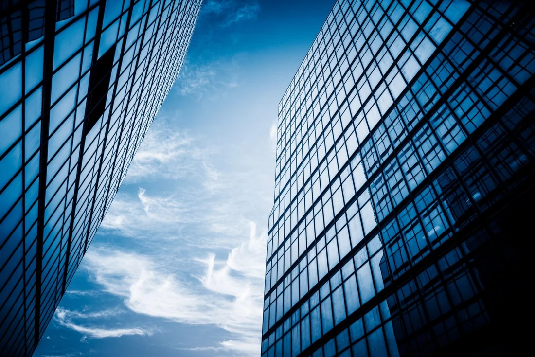 Modern glass buildings viewed from below